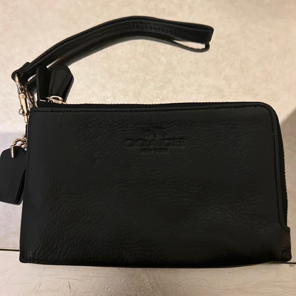 Small black coach wristlet with gold hardware